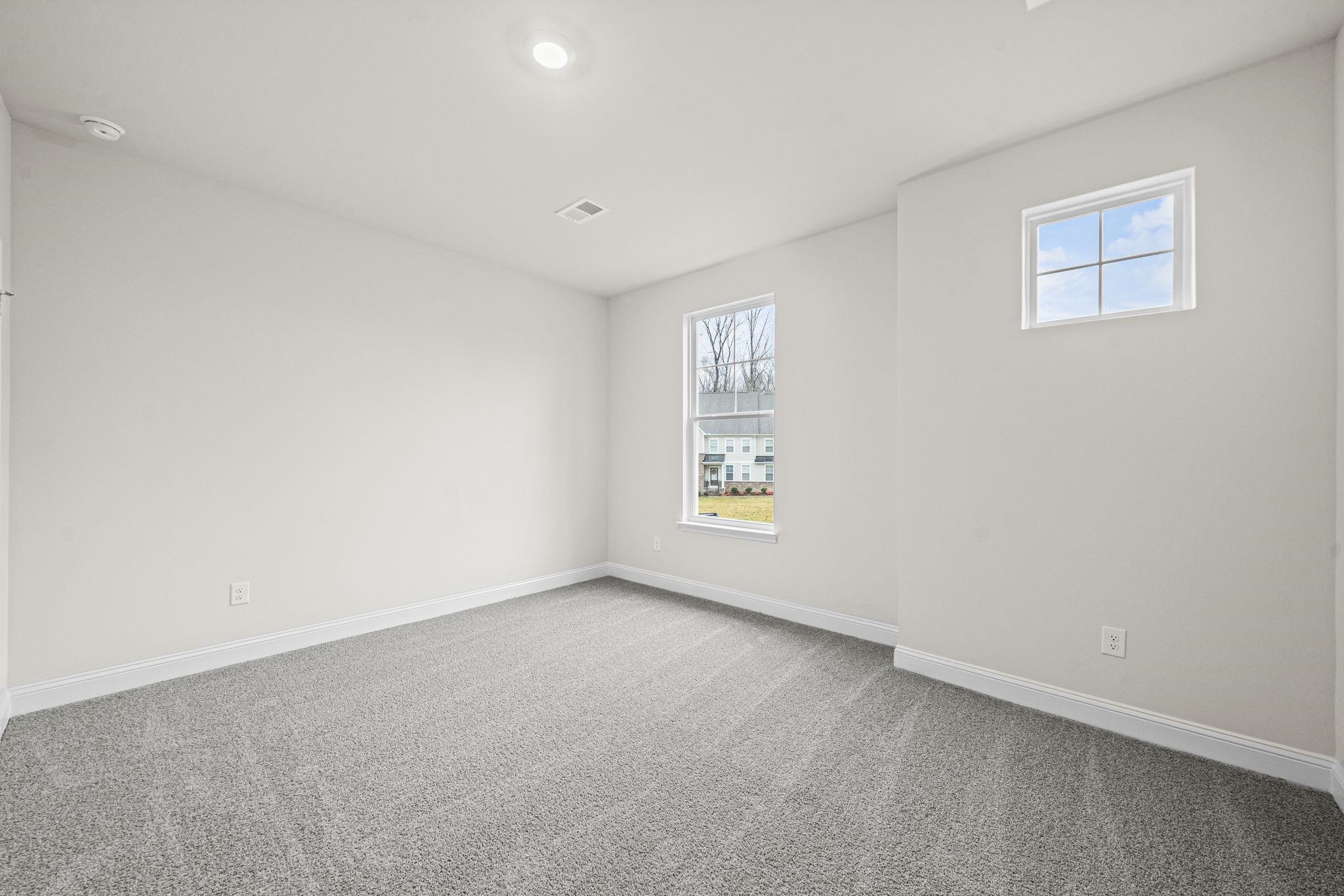 128 Jaspers Lane Stuarts Draft, VA 24477 - Photo 13 of 26 an empty room with windows