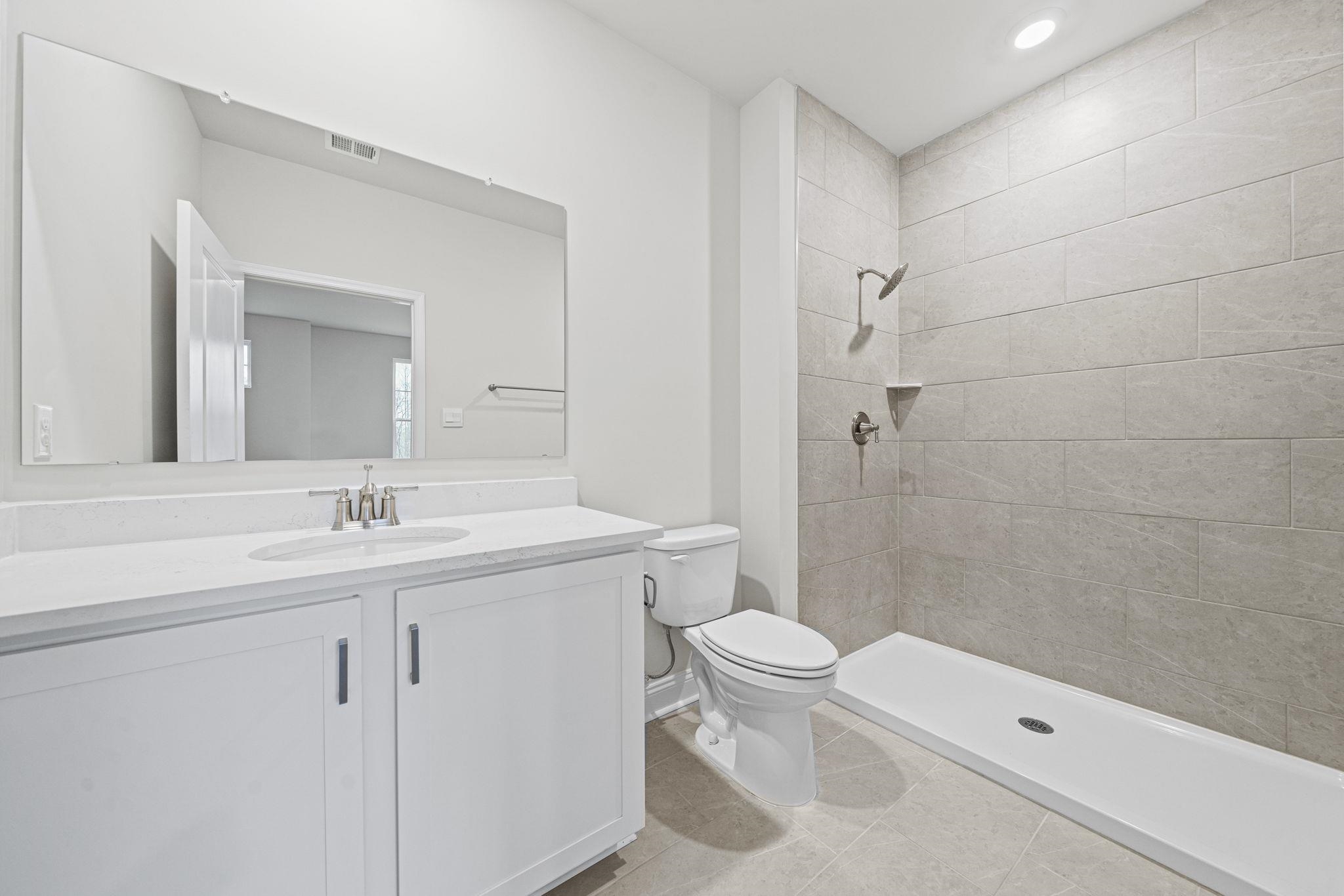 128 Jaspers Lane Stuarts Draft, VA 24477 - Photo 15 of 26 a bathroom with a sink a toilet and shower