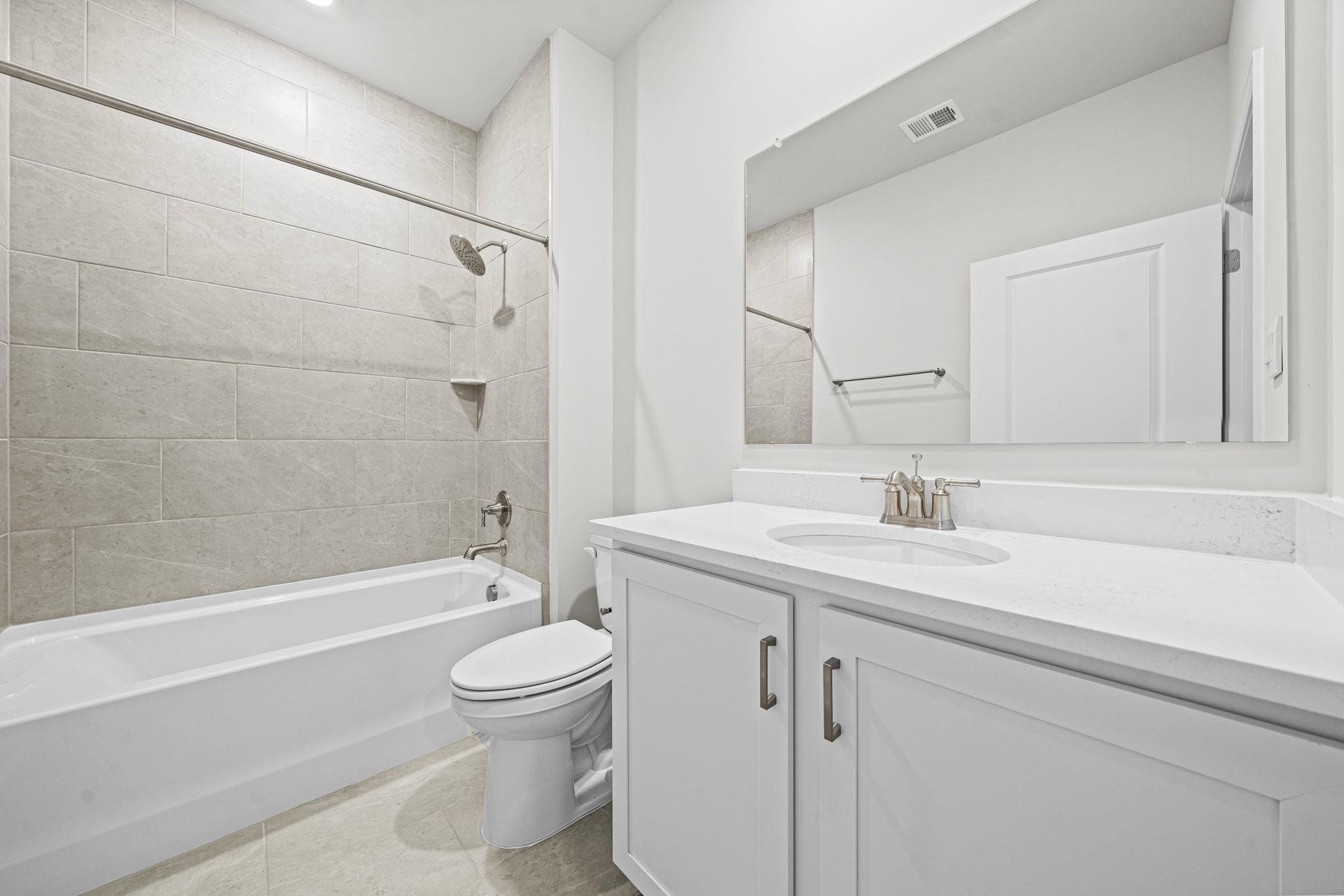 128 Jaspers Lane Stuarts Draft, VA 24477 - Photo 18 of 26 a bathroom with a sink a toilet and a bathtub