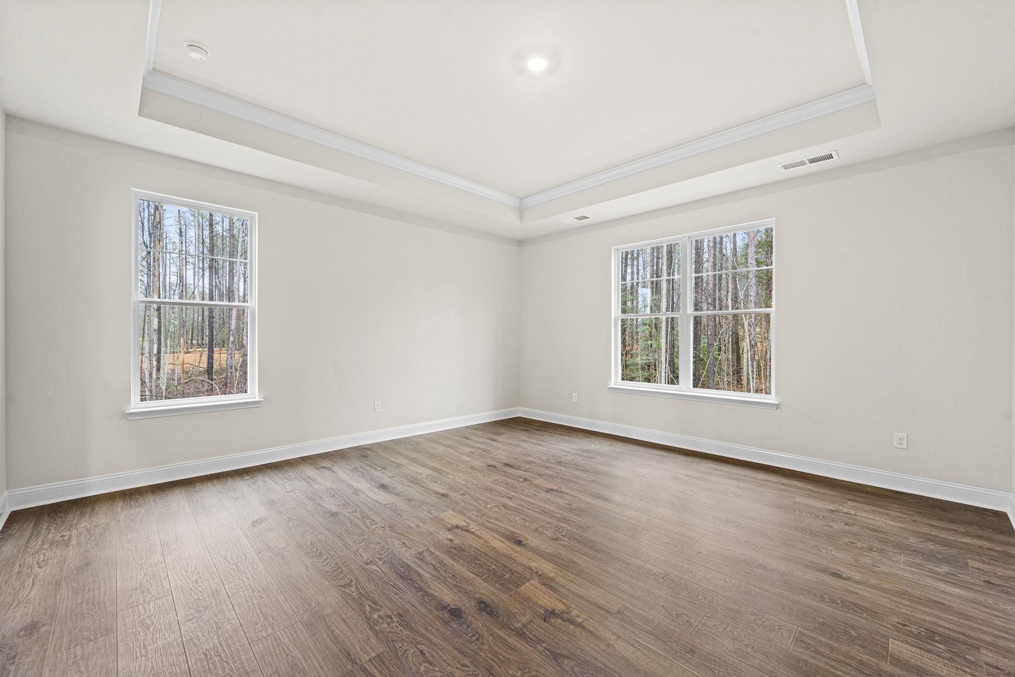 128 Jaspers Lane Stuarts Draft, VA 24477 - Photo 20 of 26 an empty room with wooden floor and windows