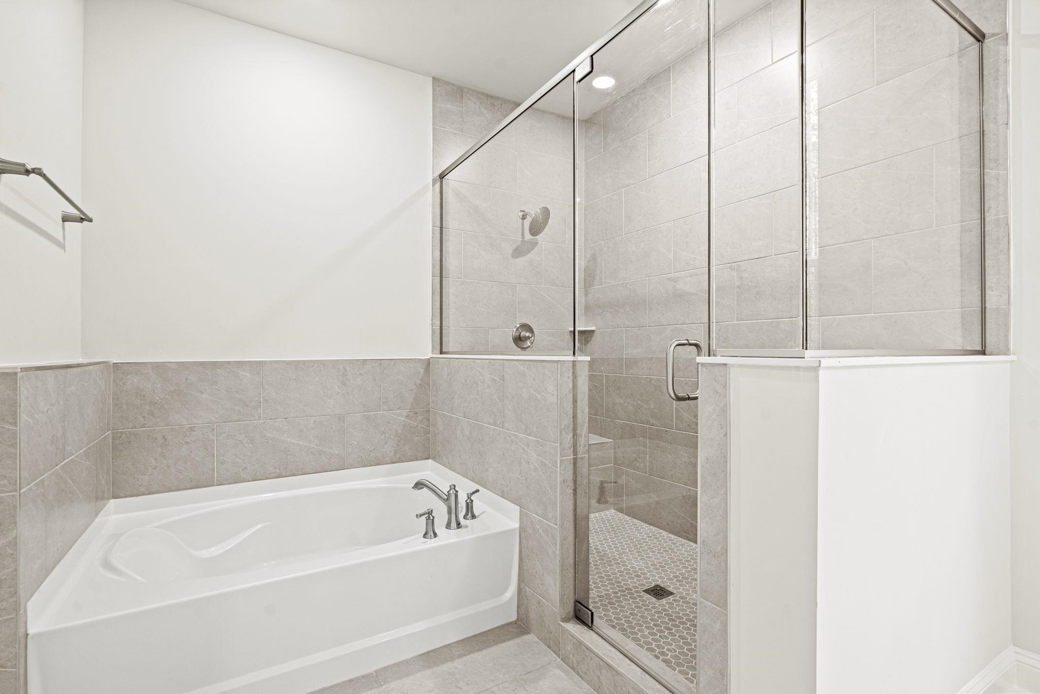 128 Jaspers Lane Stuarts Draft, VA 24477 - Photo 22 of 26 a bathroom with a bathtub and a shower