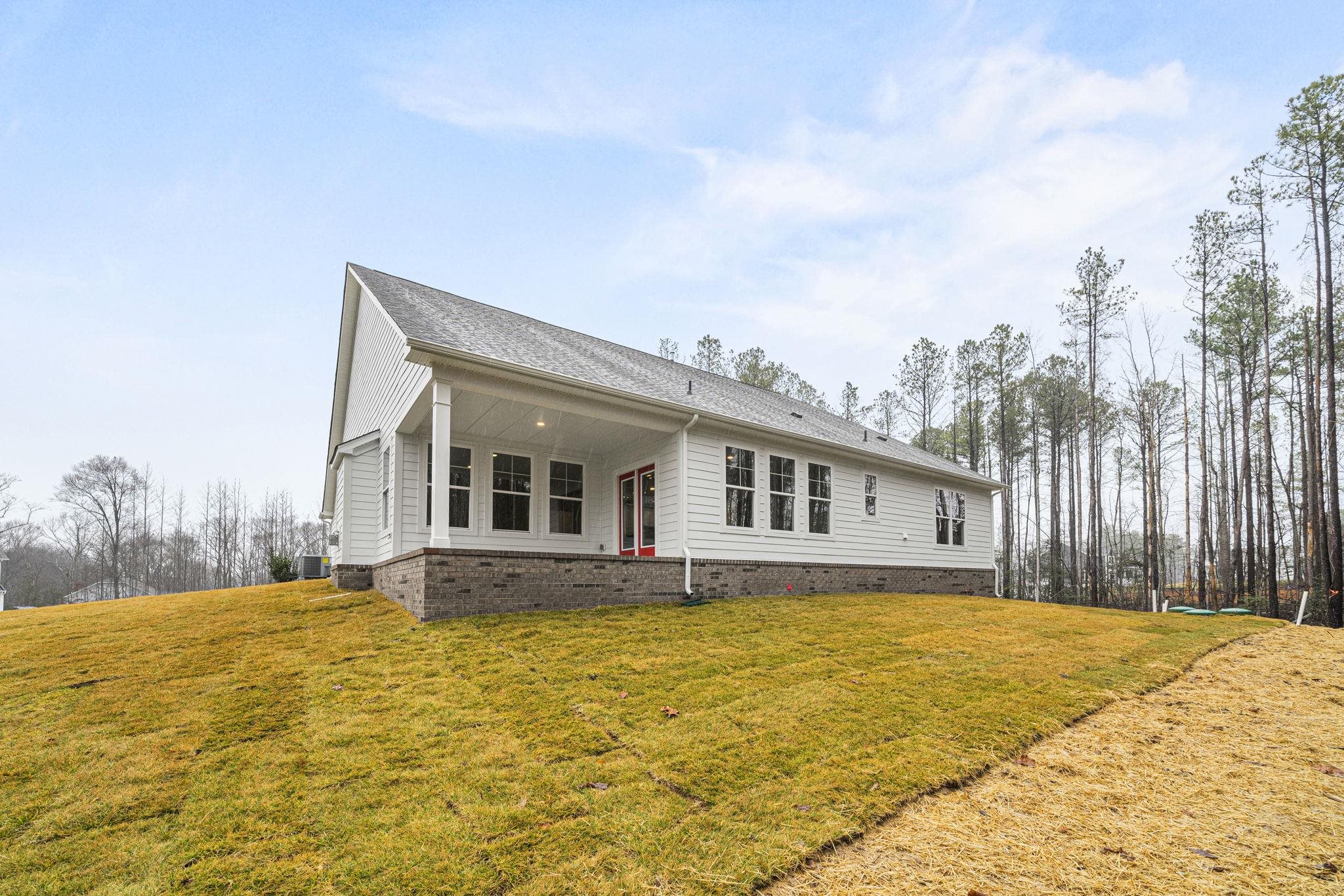128 Jaspers Lane Stuarts Draft, VA 24477 - Photo 24 of 26 a front view of house with yard and trees around