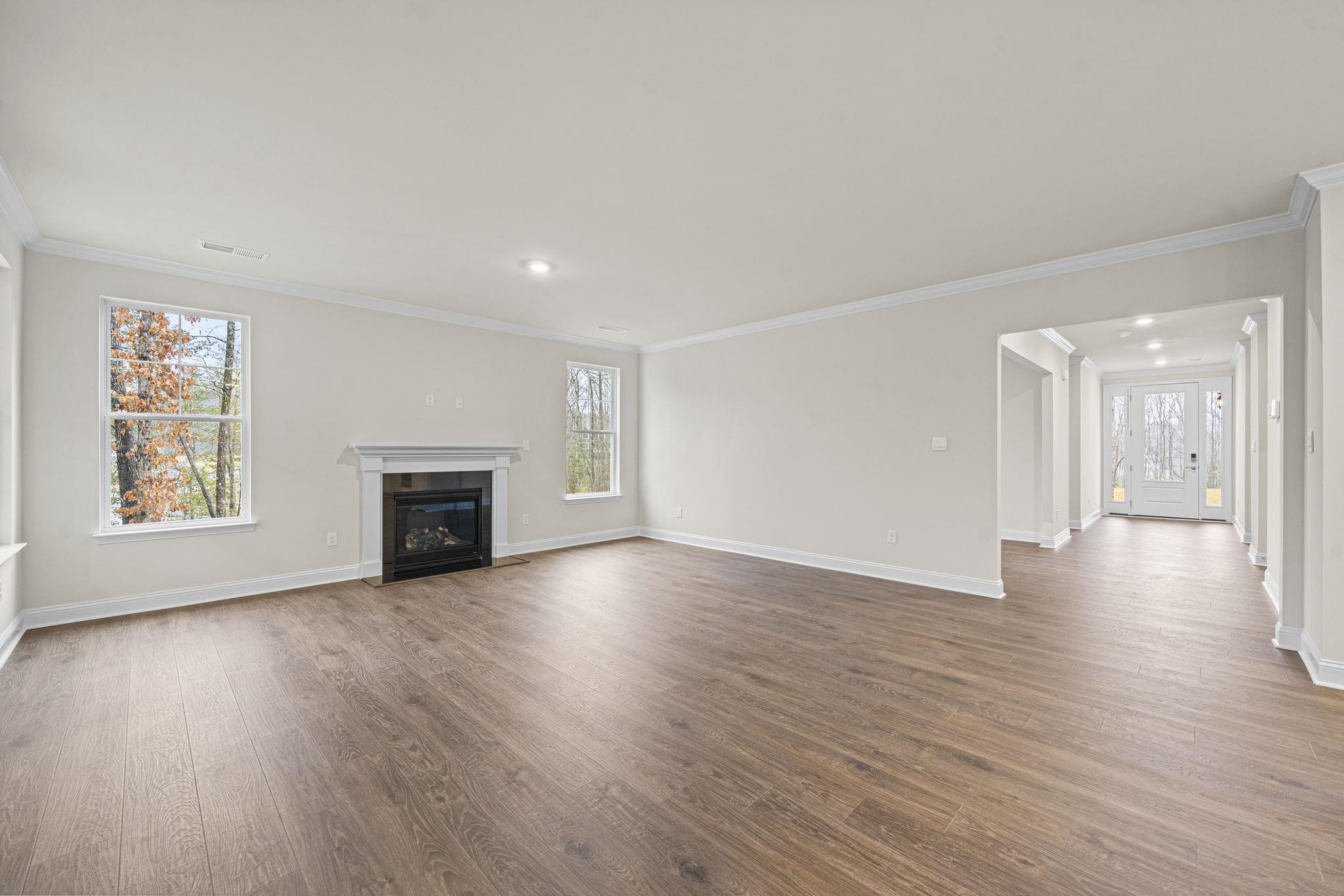 128 Jaspers Lane Stuarts Draft, VA 24477 - Photo 4 of 26 a view of an empty room with wooden floor and a window
