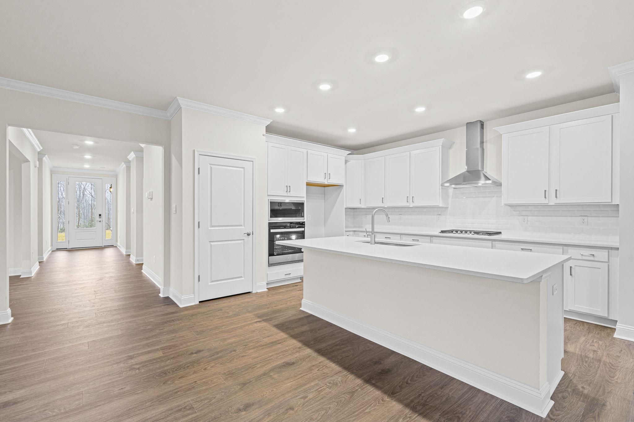 128 Jaspers Lane Stuarts Draft, VA 24477 - Photo 6 of 26 a kitchen with stainless steel appliances kitchen island wooden cabinets and center island