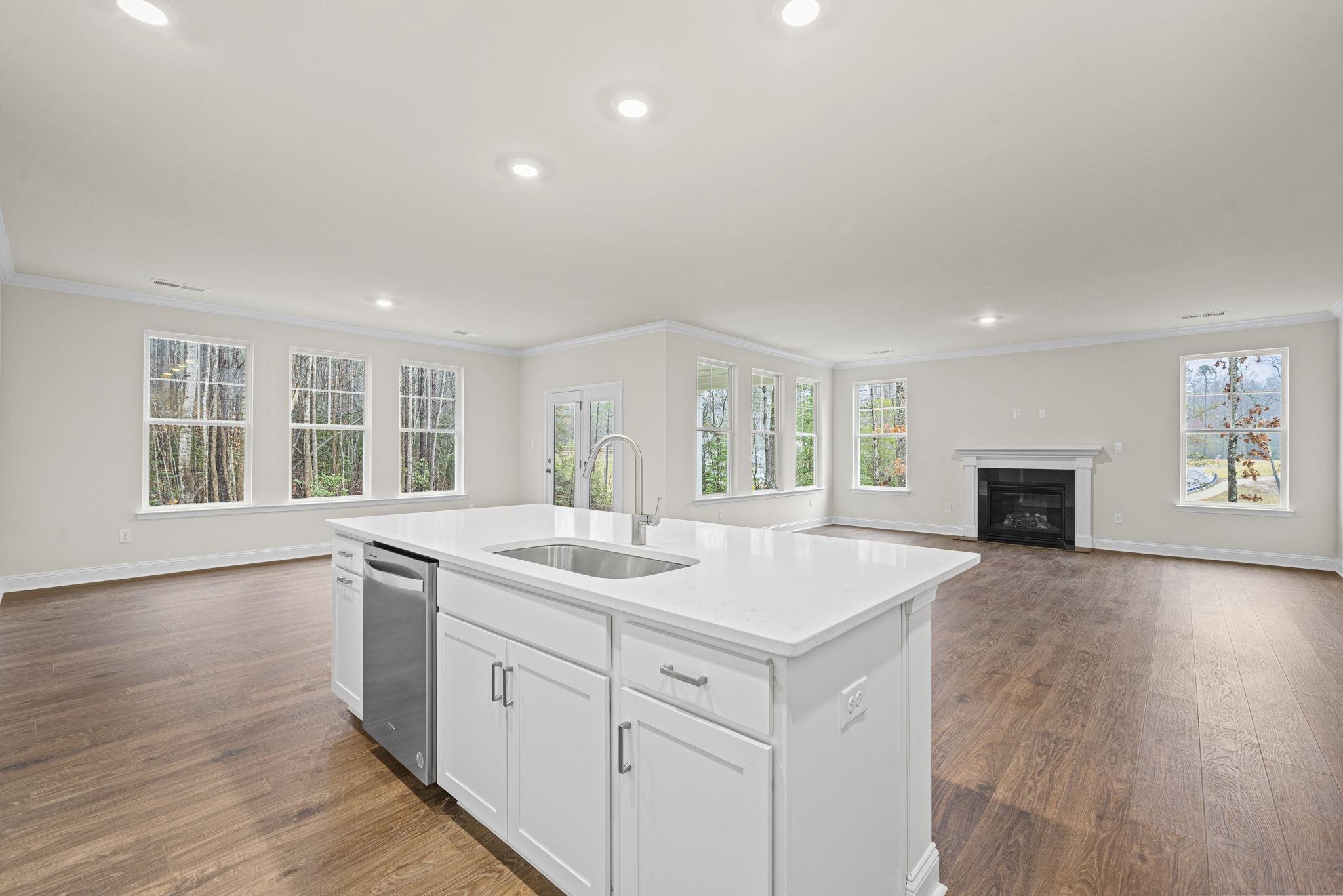 128 Jaspers Lane Stuarts Draft, VA 24477 - Photo 8 of 26 a view of kitchen with sink wooden floor and windows