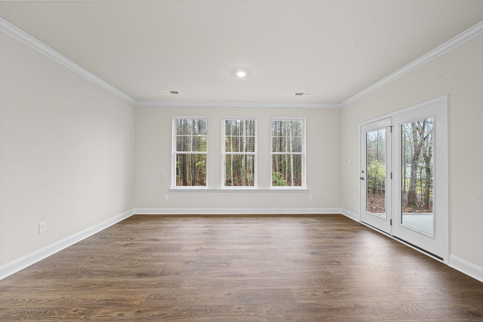 128 Jaspers Lane Stuarts Draft, VA 24477 - Photo 10 of 26 a view of an empty room with wooden floor and a window