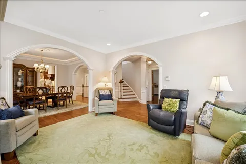 a living room with furniture and a lamp