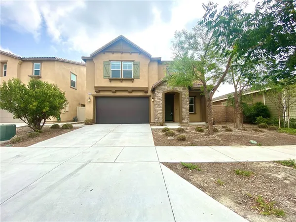 a front view of a house with yard