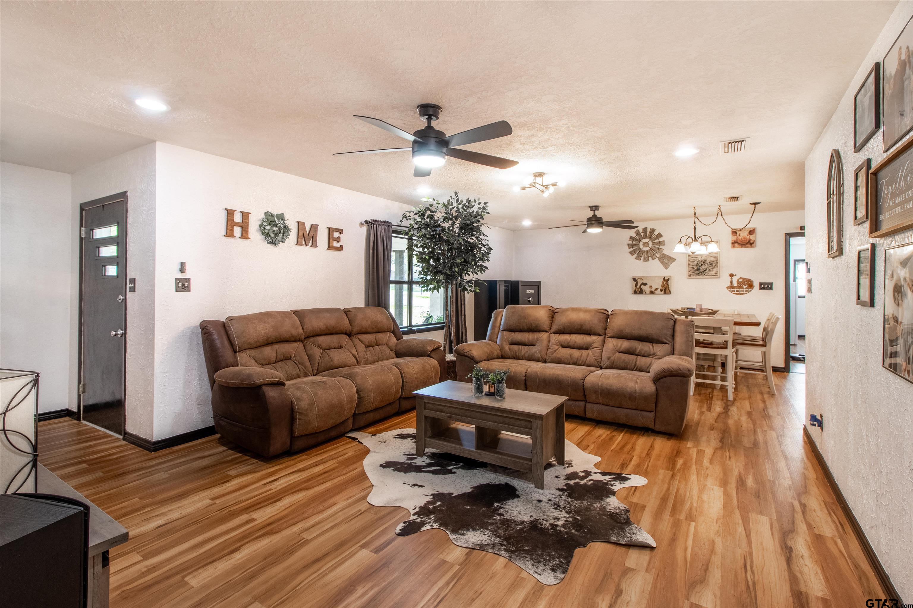 513 Lance Road Quitman, TX 75783 - Photo 4 of 27 a living room with furniture and a wooden floor