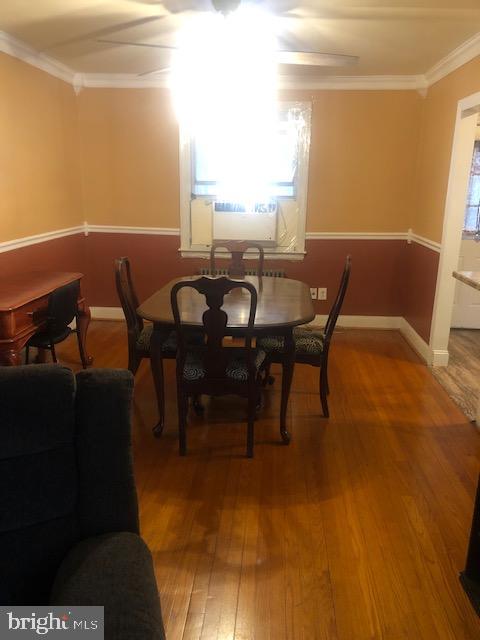 3804 Kimble Road Baltimore, MD 21218 - Photo 4 of 16 a view of a dining room with furniture and a window