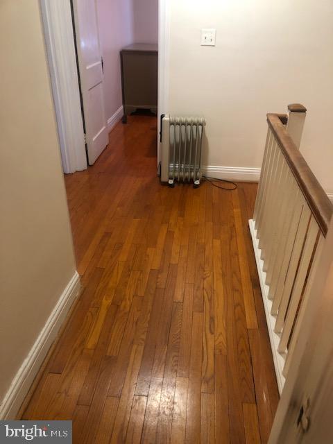3804 Kimble Road Baltimore, MD 21218 - Photo 5 of 16 a view of an empty room with wooden floor