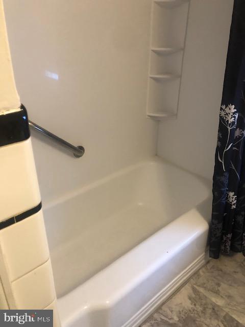 3804 Kimble Road Baltimore, MD 21218 - Photo 9 of 16 a bathroom with a bathtub