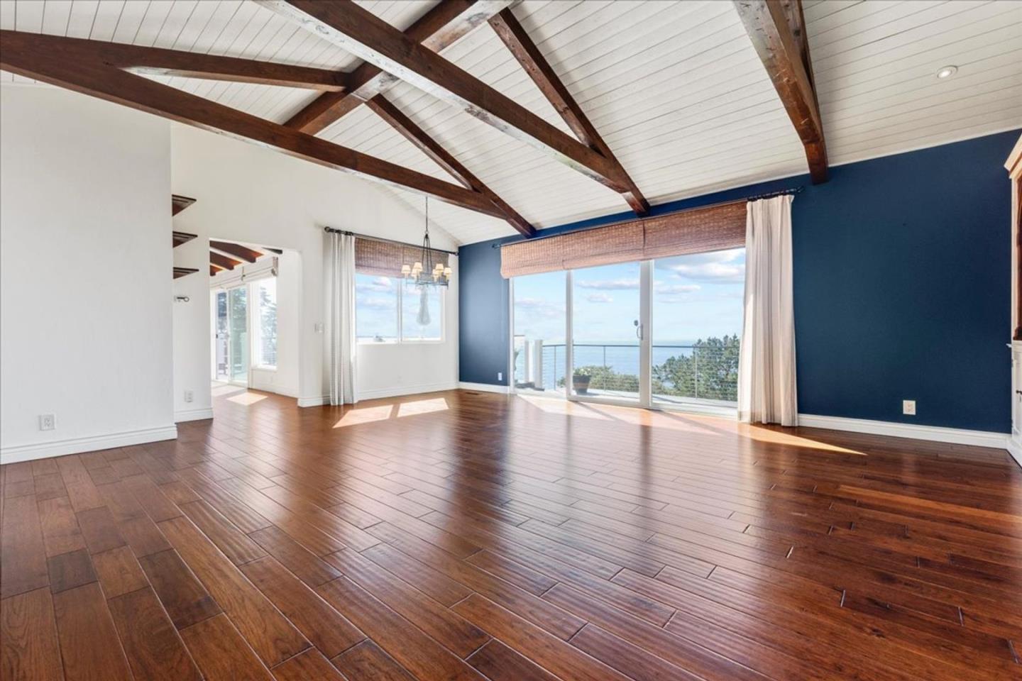 15 Mentone Road Carmel, CA 93923 - Photo 16 of 47 a view of an empty room with wooden floor and a window