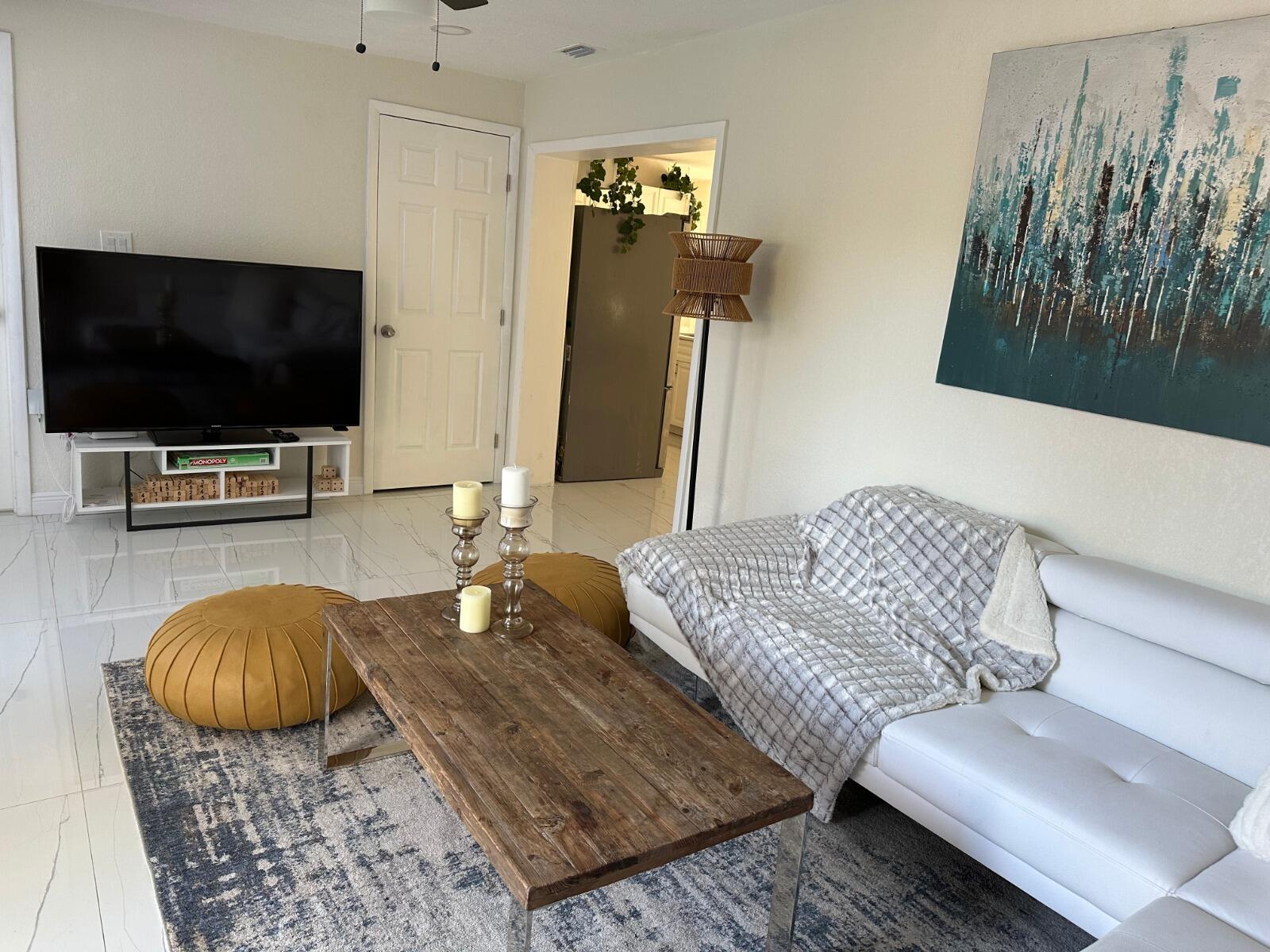 5131 Southwest 6th Court Margate, FL 33068 - Photo 11 of 25 a living room with furniture and a flat screen tv