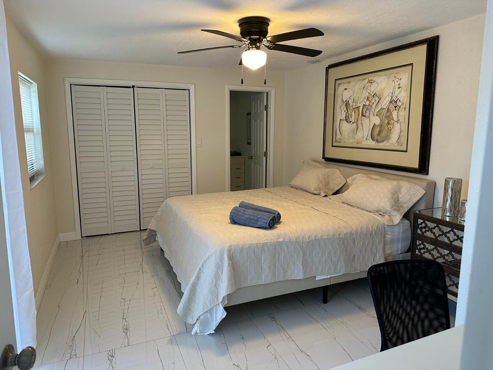 5131 Southwest 6th Court Margate, FL 33068 - Photo 13 of 25 a bedroom with a bed and a painting on the wall