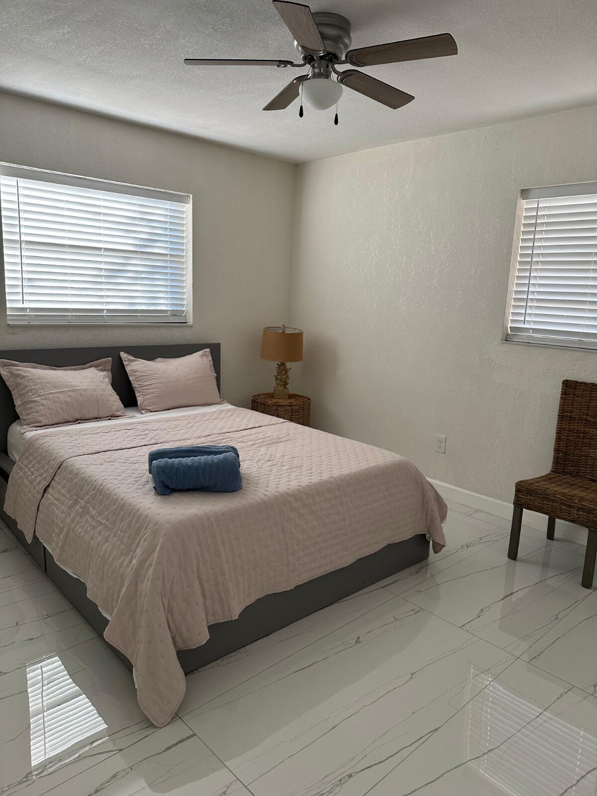5131 Southwest 6th Court Margate, FL 33068 - Photo 15 of 25 a bedroom with a bed and window