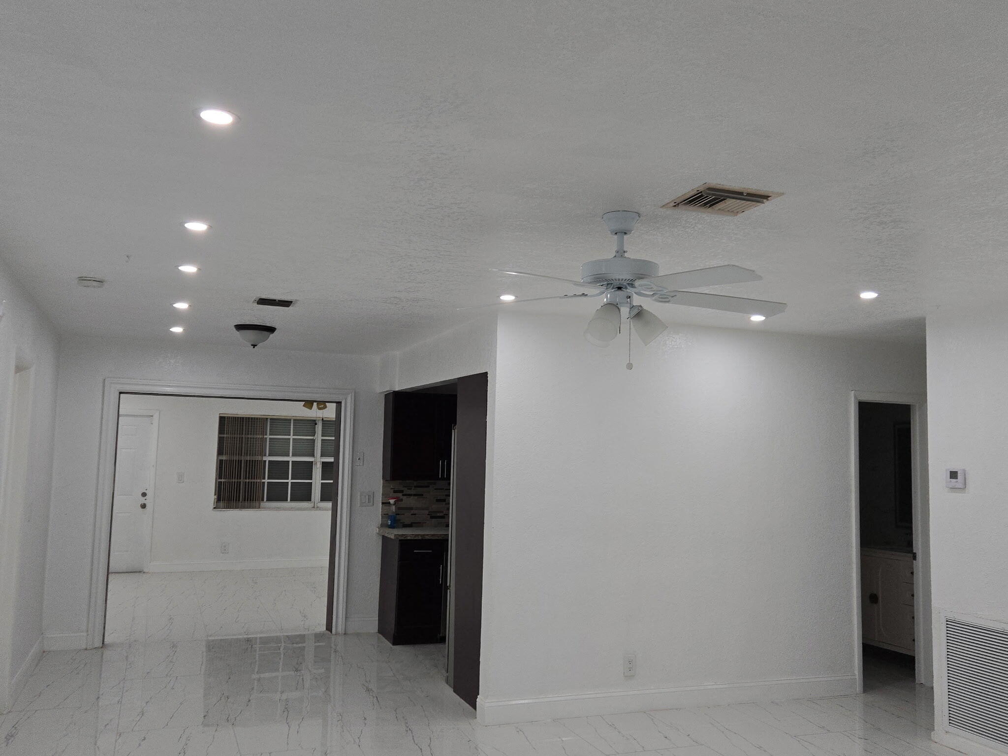 5131 Southwest 6th Court Margate, FL 33068 - Photo 21 of 25 wooden floor in an empty room with a ceiling fan