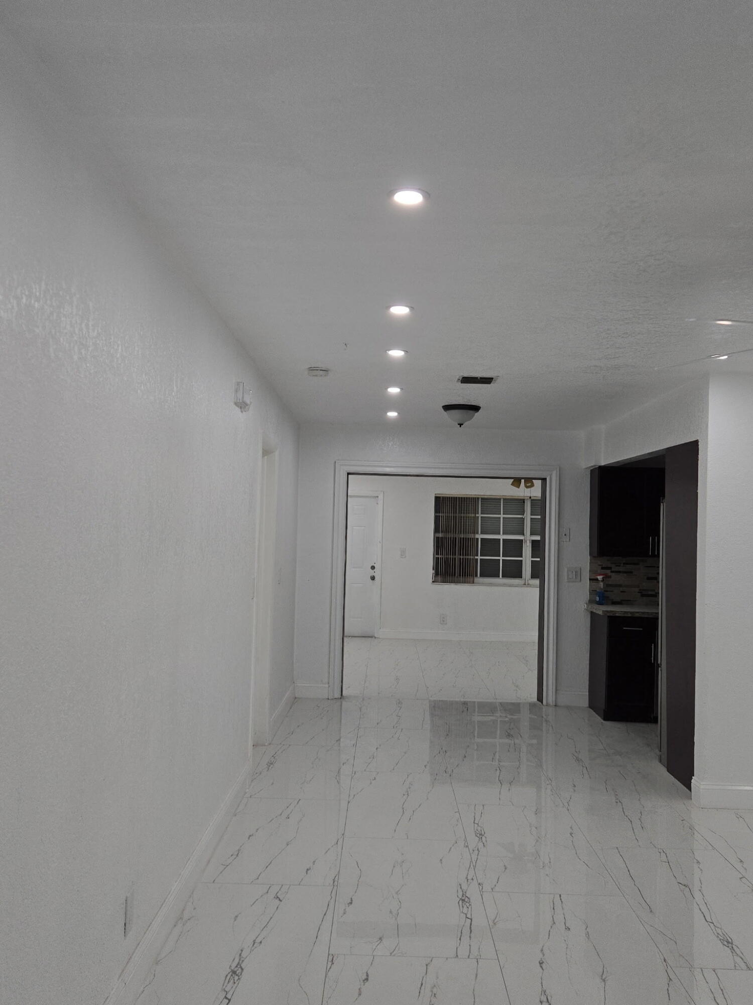 5131 Southwest 6th Court Margate, FL 33068 - Photo 22 of 25 a view of empty room with kitchen
