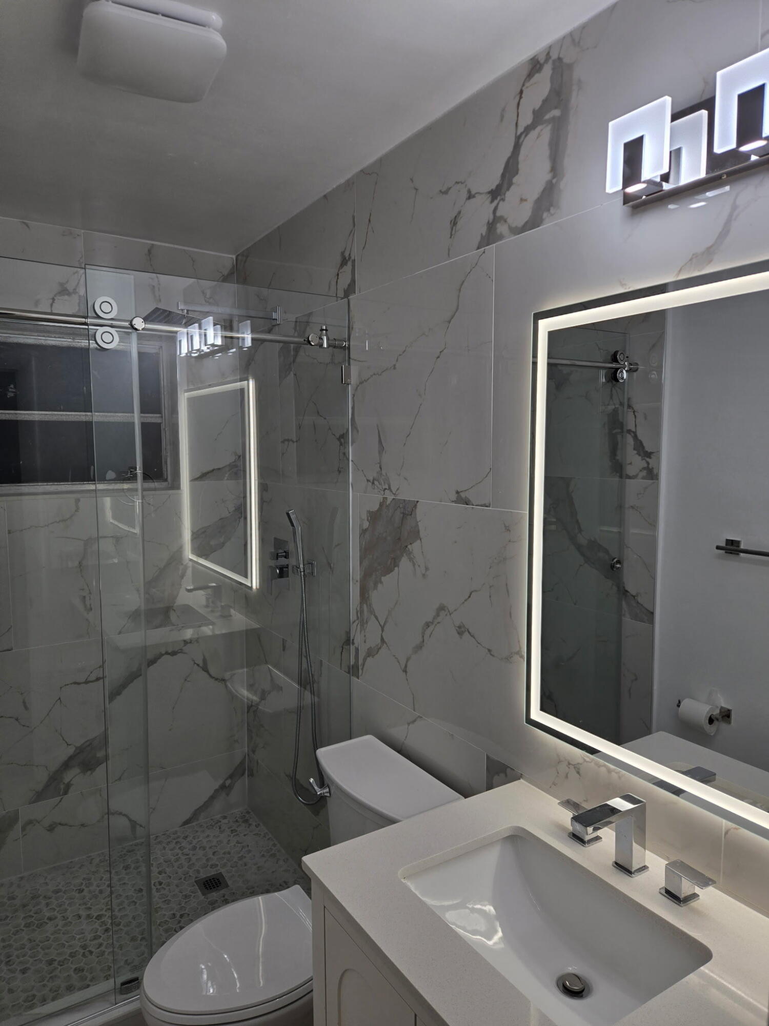 5131 Southwest 6th Court Margate, FL 33068 - Photo 23 of 25 a bathroom with a sink toilet and shower
