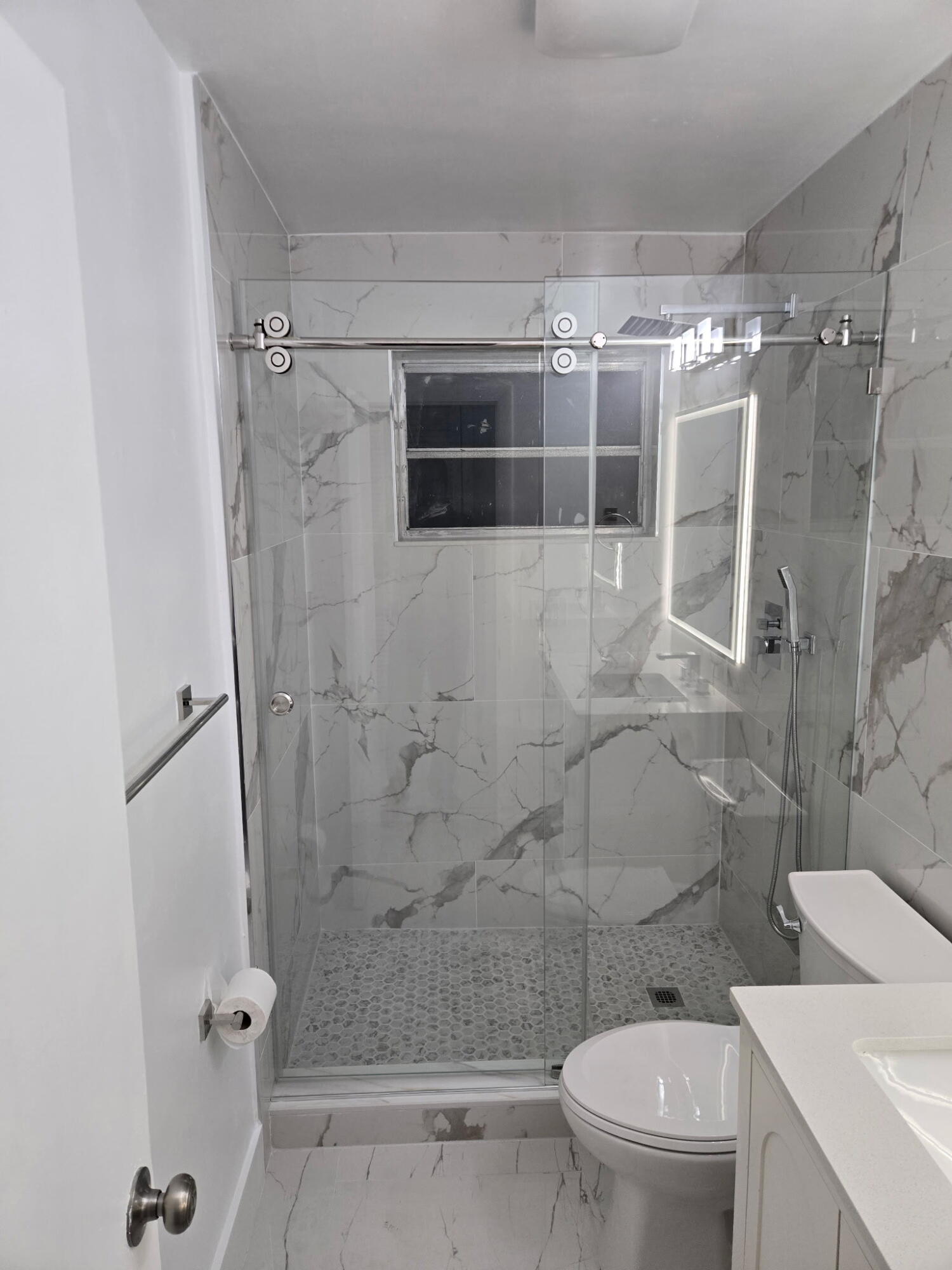 5131 Southwest 6th Court Margate, FL 33068 - Photo 24 of 25 a bathroom with a shower a toilet and a sink