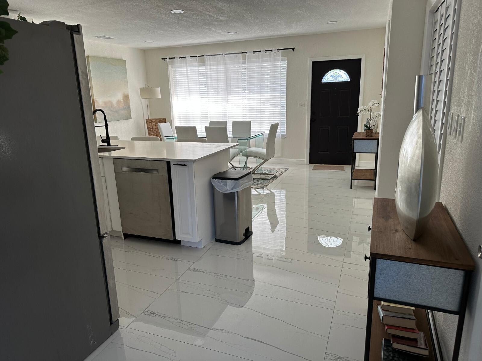 5131 Southwest 6th Court Margate, FL 33068 - Photo 9 of 25 a kitchen with a sink appliances and cabinets