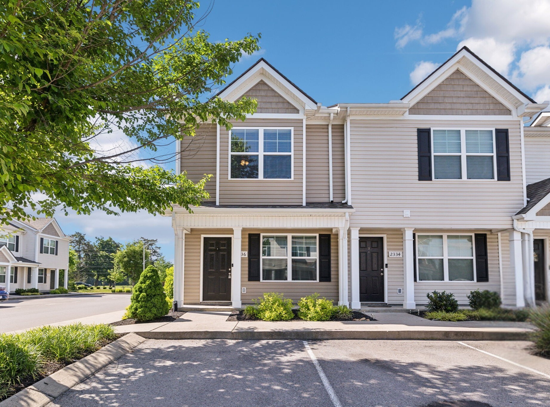 2336 Convention Way Murfreesboro, TN 37130 - Photo 23 of 23 front view of a brick house with a yard and large trees