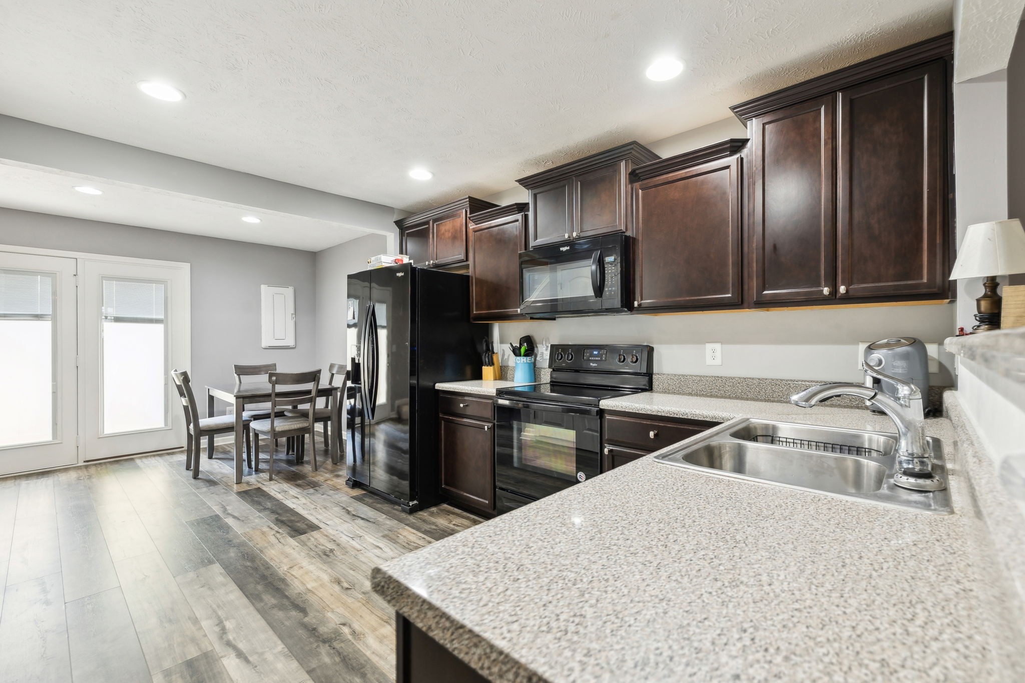 2336 Convention Way Murfreesboro, TN 37130 - Photo 6 of 23 a kitchen with granite countertop a sink stove and refrigerator