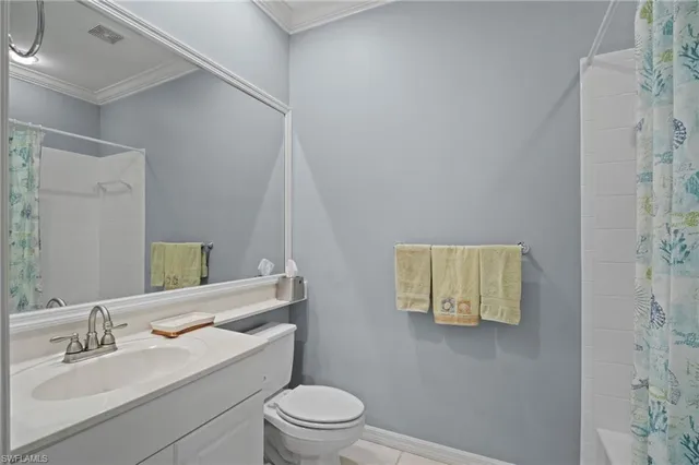 a bathroom with a sink toilet and mirror