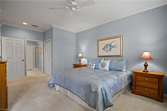 a bedroom with a bed and a lamp