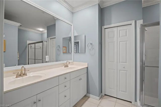 a bathroom with double sink and a mirror