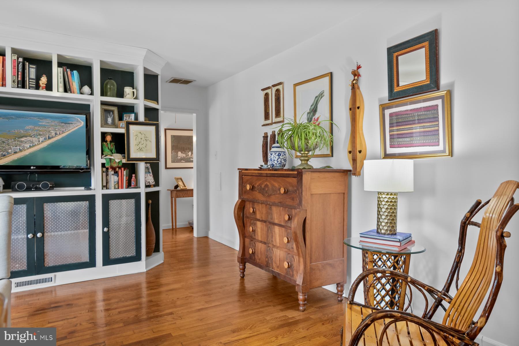 103 Buckingham Road Berlin, MD 21811 - Photo 22 of 62 a view of a dining room with furniture and a book shelf