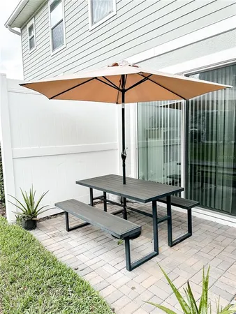 a swimming pool with outdoor seating