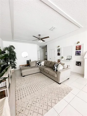 a living room with furniture and white walls