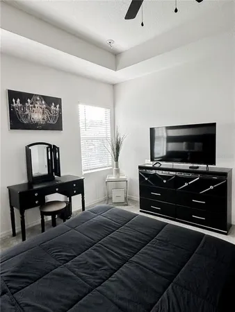 a bedroom with a bed and a piano