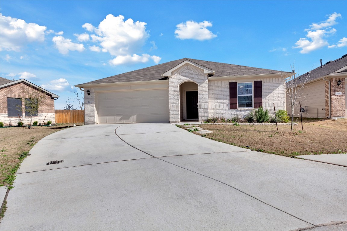 238 Sickle Loop Uhland, TX 78640 - Photo 1 of 29 a view of a house with a yard