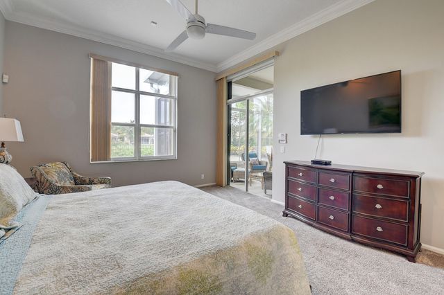 a spacious bedroom with a bed and a couch