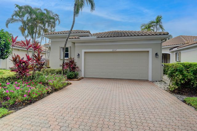 a front view of a house with a garage
