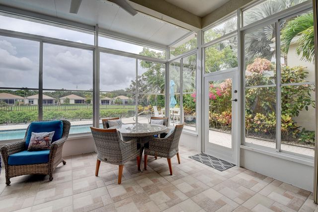 a view of swimming pool with outdoor seating and plants