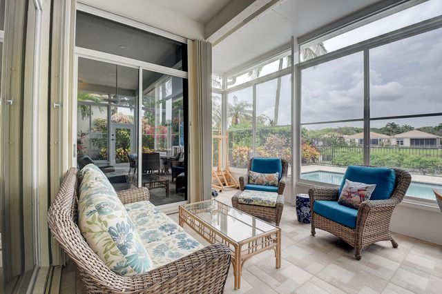a view of a swimming pool with a patio and a yard