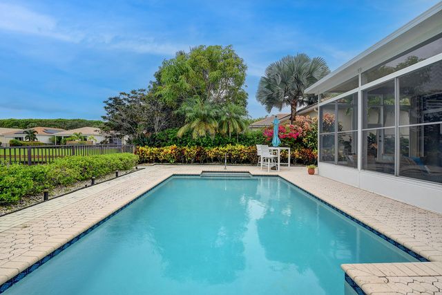 a view of a lake with houses in the back