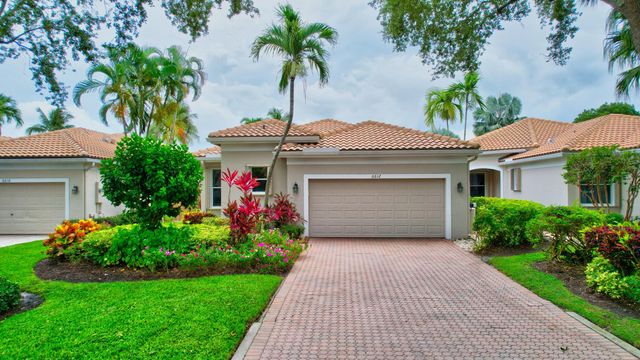 an aerial view of residential houses with outdoor space and lake view