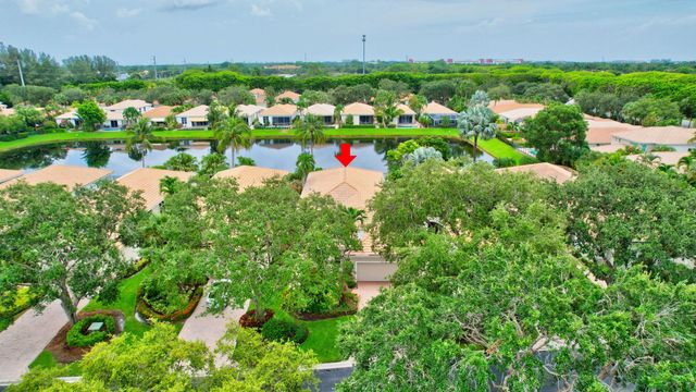 an aerial view of multiple houses with yard