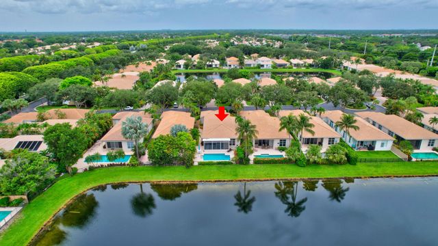 a view of a garden with a building in the background