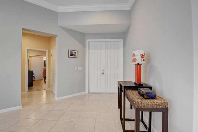 a room with furniture and a potted plant