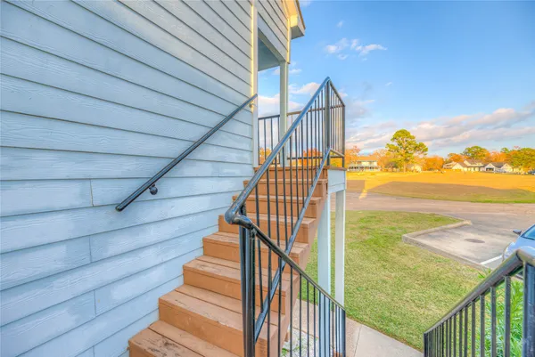 a view of staircase with wooden floor and stairs