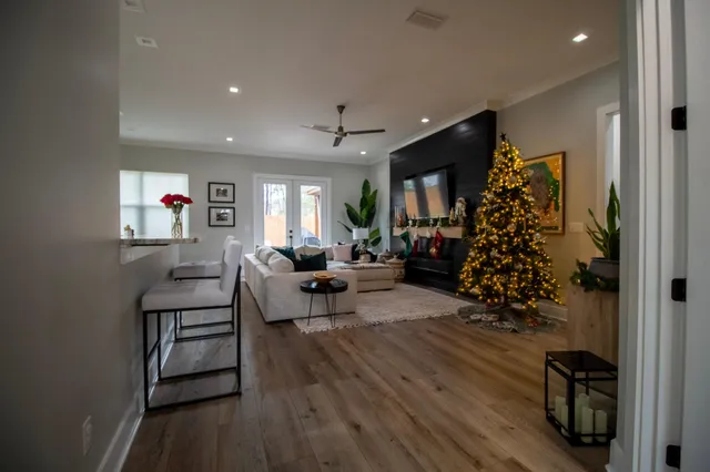 a living room with furniture and a fireplace