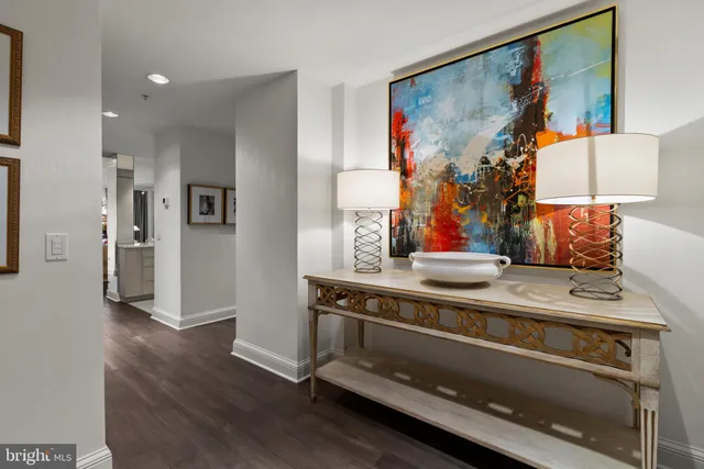 a view of an entryway with wooden floor