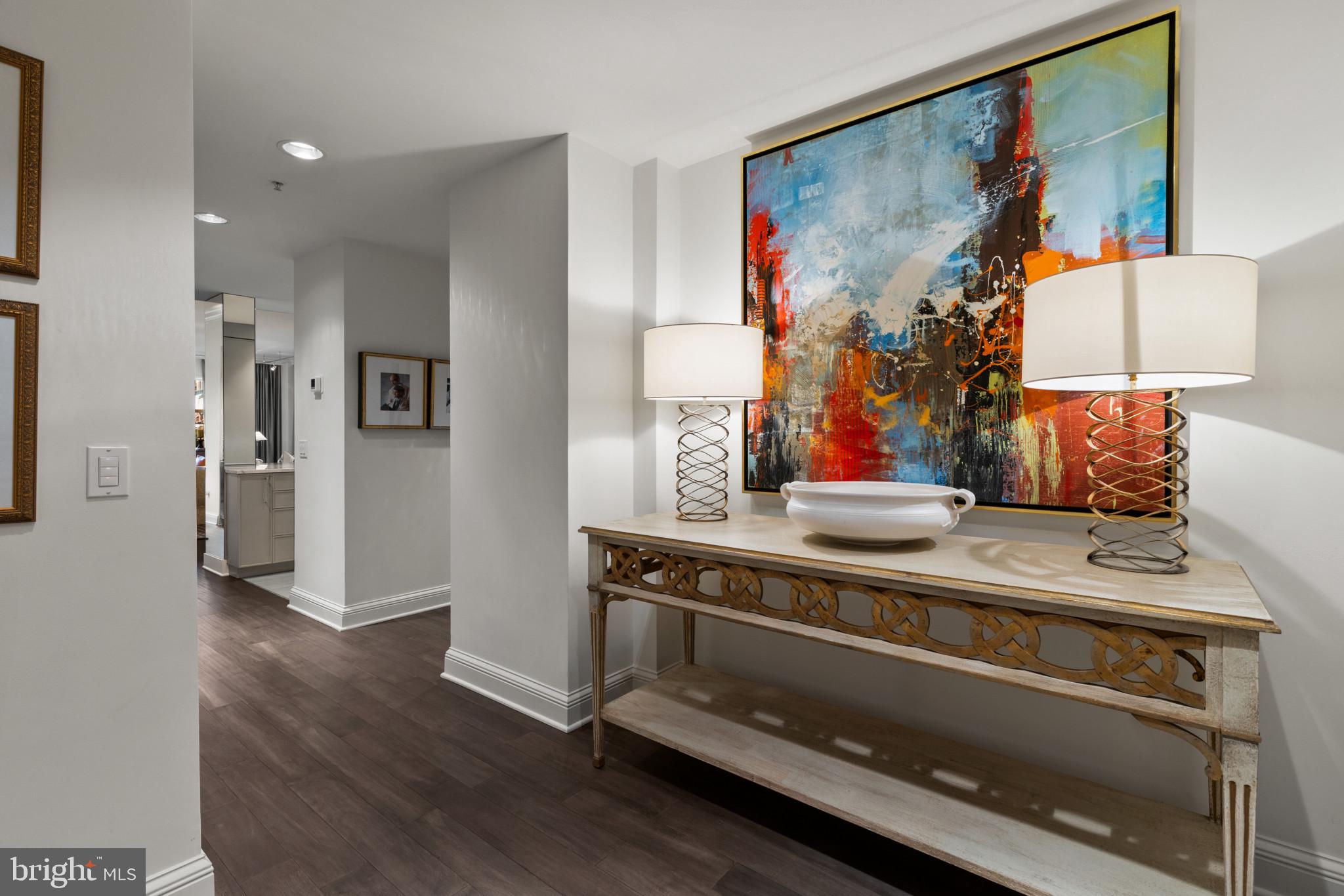 801 Key Highway, Unit 110 Baltimore, MD 21230 - Photo 2 of 78 a view of a hallway with wooden floor and cabinet