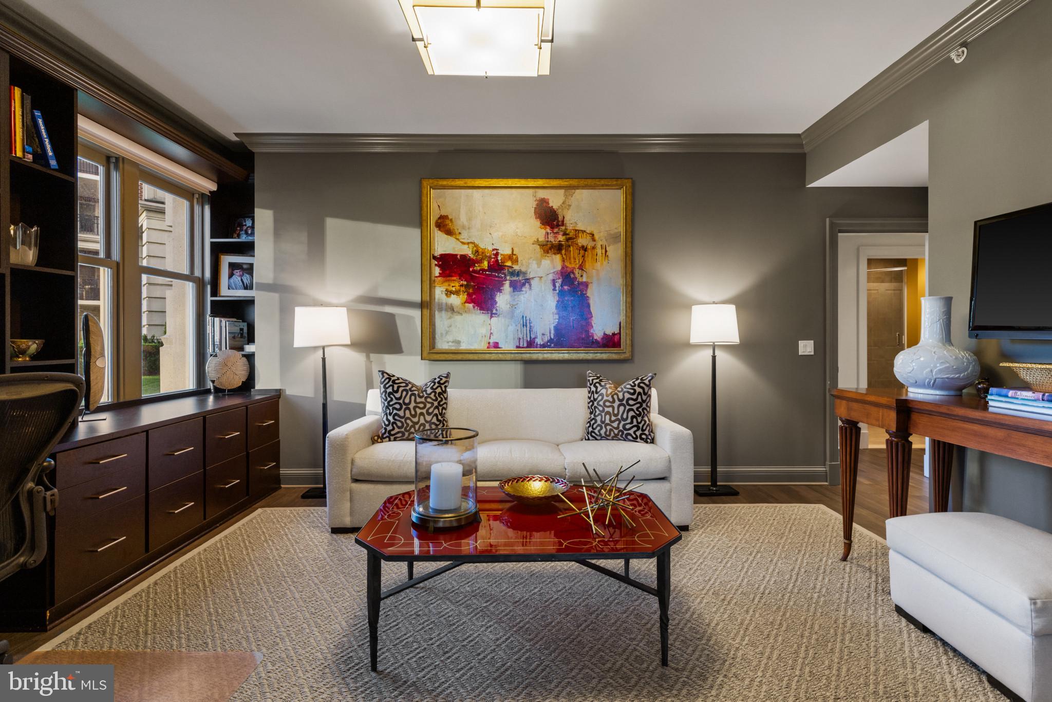 801 Key Highway, Unit 110 Baltimore, MD 21230 - Photo 30 of 78 a living room with furniture a rug and a painting on the wall