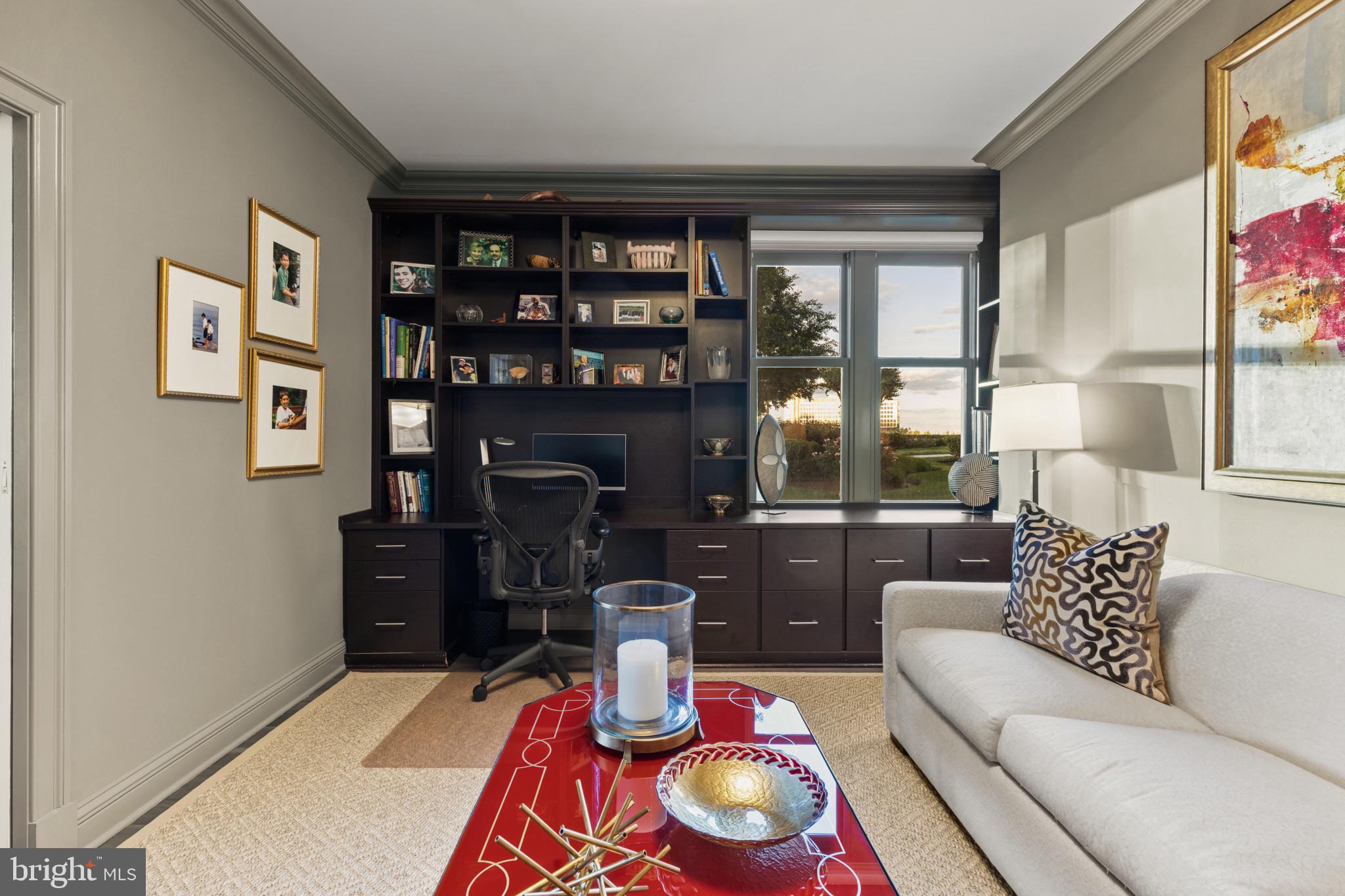 801 Key Highway, Unit 110 Baltimore, MD 21230 - Photo 33 of 78 a living room with furniture and a floor to ceiling window